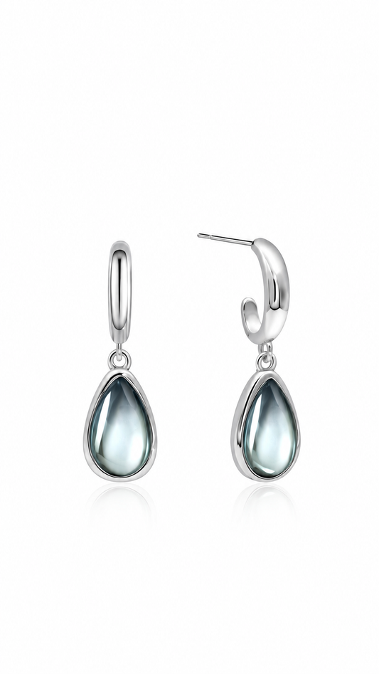 Boucles d'oreilles Goutte Lagon en acier inoxydable argenté, pendant goutte bleu-gris, sur fond blanc